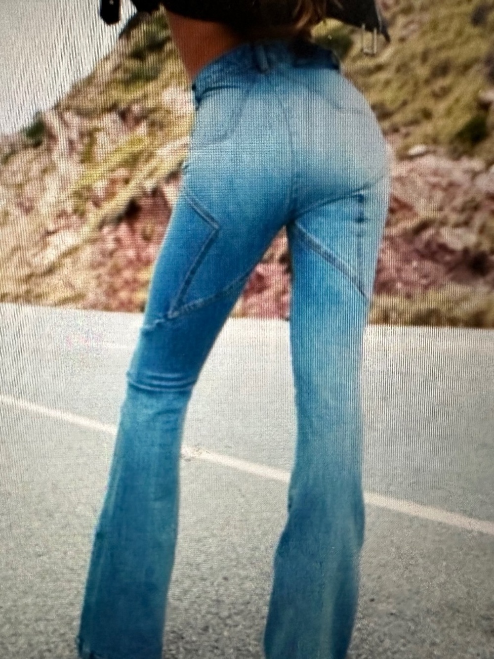 Revise  boot cut stretch denim with distressed hem
